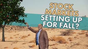 man grabbing an apple from a lone tree while in the middle of the desert. Stock markets setting up for fall?